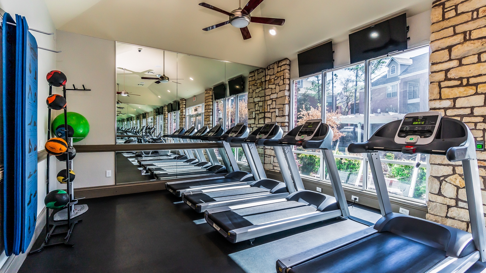 A gym with treadmills and exercise equipment.